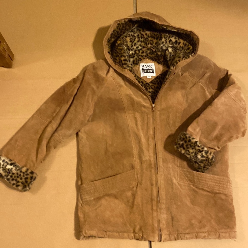 Womens Small leather jacket with faux cheetah fur inside.
